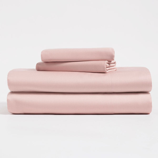 Salmon pink, Lyocell Cotton sheet set, including flat sheet, fitted sheet, and two pillow cases.